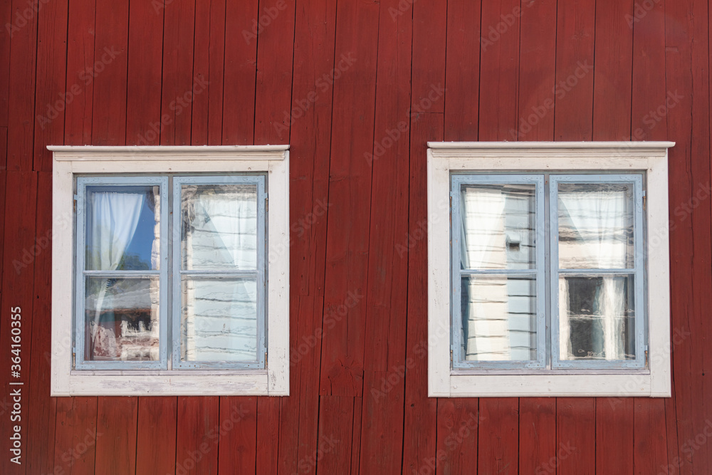 Background. Windows in a wooden house. Scandinavian architecture, old houses. Finland. Background. Windows in a wooden house. Scandinavian architecture, old houses. Finland.