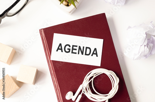 text agenda printed on burgundy paper and diary. High quality photo