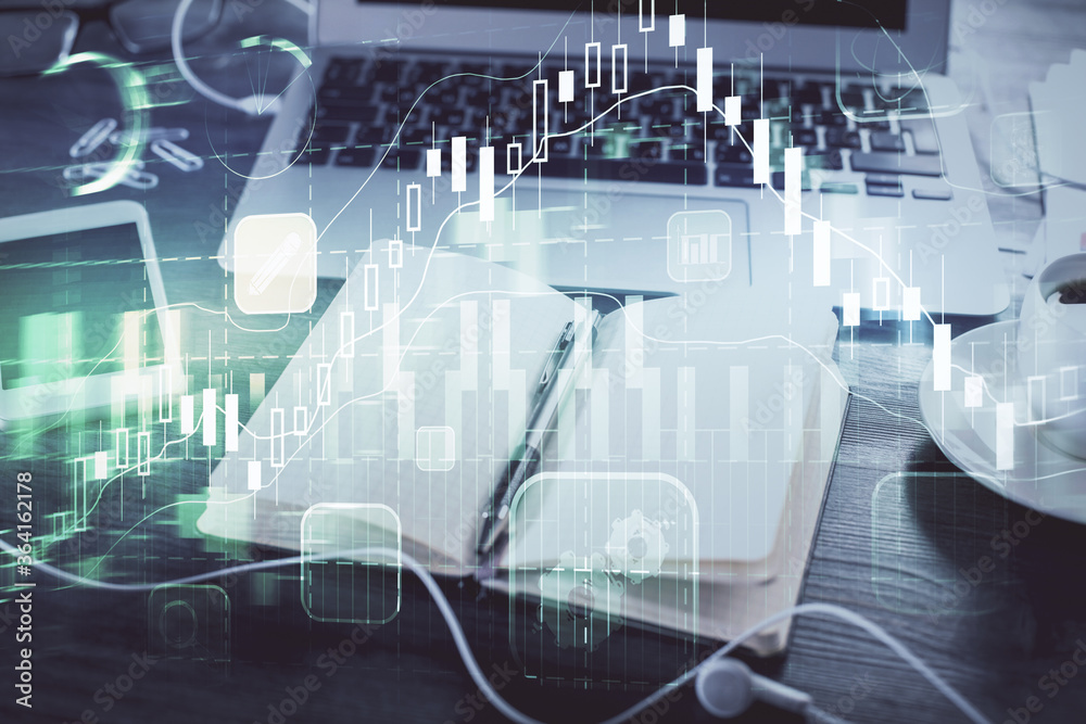 Multi exposure of financial graph drawings and desk with open notebook background. Concept of forex Multi exposure of financial graph drawings and desk with open notebook background. Concept of forex