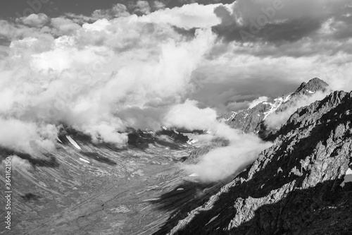 Clouds skirting over the valley and skimming over the peaks