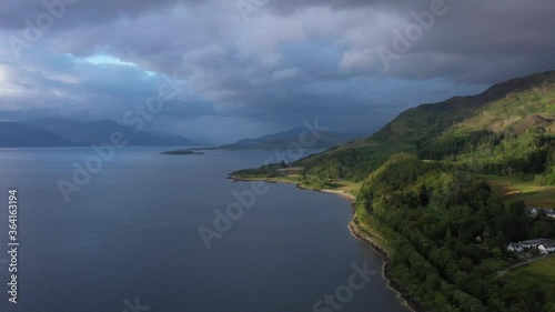 Aerial footage of the sound of shuna and shuna island on the west coast of the argyll region of the highlands of Scotland during a summer storm showing a salmon fish farm photo