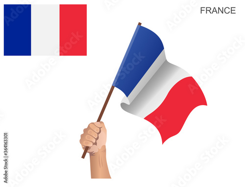 Flag of the Country of France hoisted with a stick held by hand to inflame the spirit of statehood