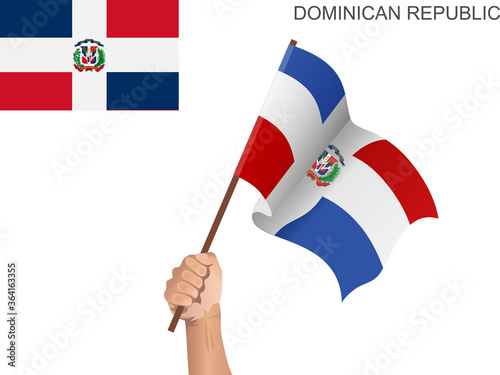 Flag of the Dominican Republic raised with a stick held by hand to inflame the spirit of statehood