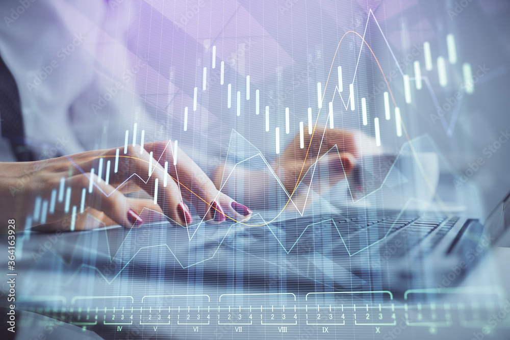 Multi exposure of woman hands typing on computer and financial graph hologram drawing. Stock market analysis concept.