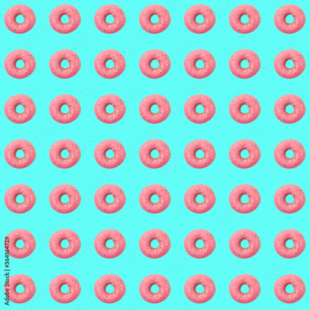Donuts seamless pattern in pink glaze on a blue background.