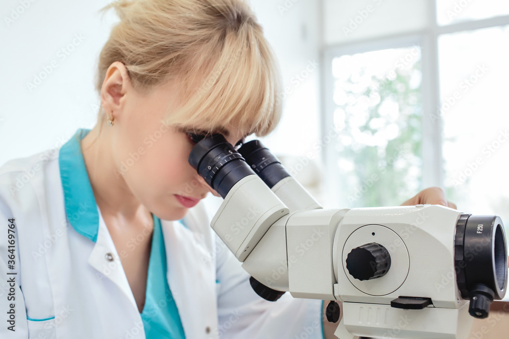 Fototapeta premium Woman gynecologist working with colposcope