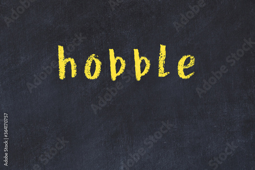 College chalk desk with the word hobble written on in