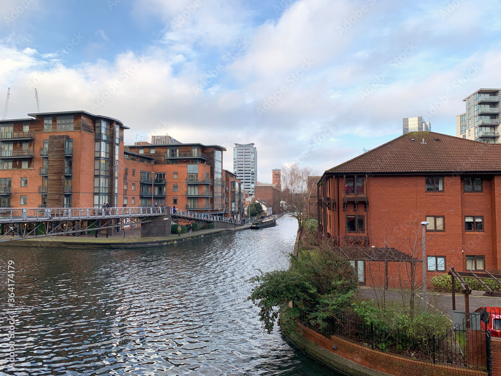 City of Birmingham, United Kingdom, showing buildings and canal system with residential apartments.