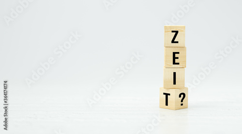 cubes with German message for TIME? on white background