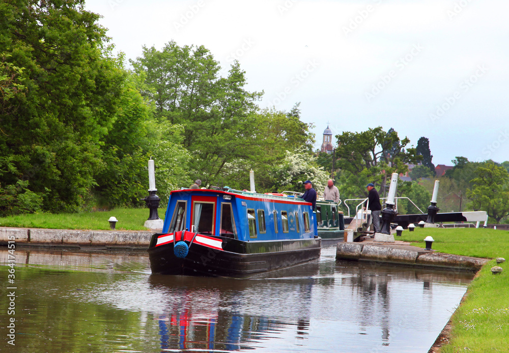 Beautiful canal in United Kingdom, featuring trees, water and boats