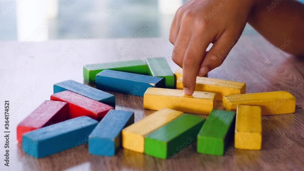 hand holding a wooden blocks hand holding a wooden blocks