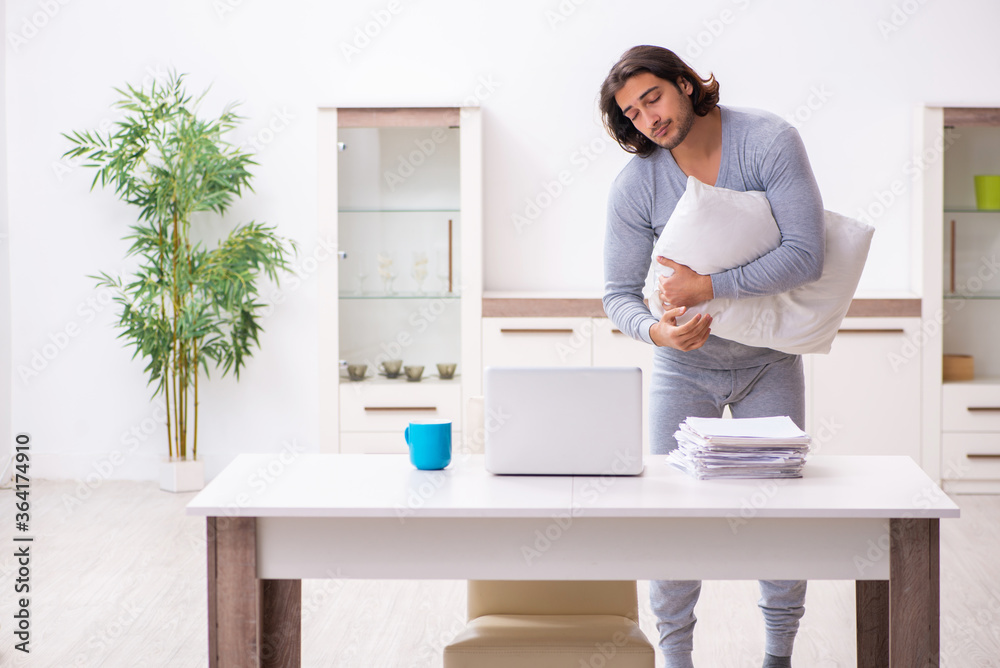 Young male employee freelancer working from home Young male employee freelancer working from home