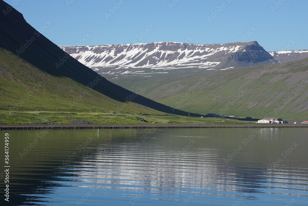 Lake, mountain, snow in Iceland. Landscape photo for art decoration and blog story.