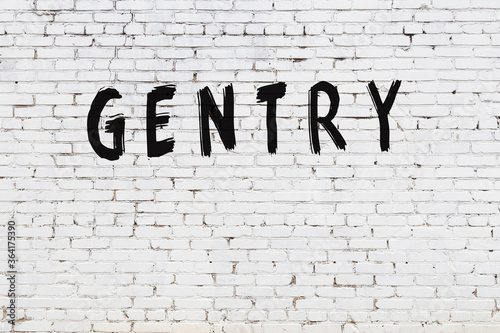 Schilderij op canvas Inscription gentry painted on white brick wall