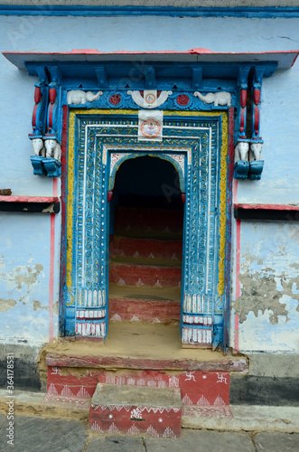 A old house main door gate wood art in the rural village of india
