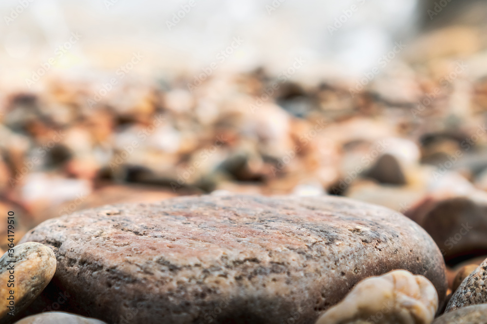 Selective focus on rocks texture with blur beach in background. Selective focus on rocks texture with blur beach in background.