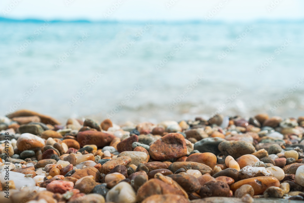 Selective focus on rocks texture with blur beach in background. Selective focus on rocks texture with blur beach in background.