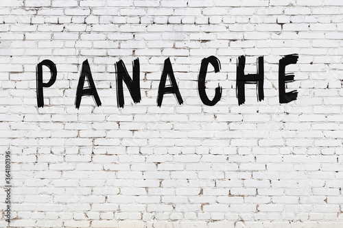 White wall with black paint inscription panache on it