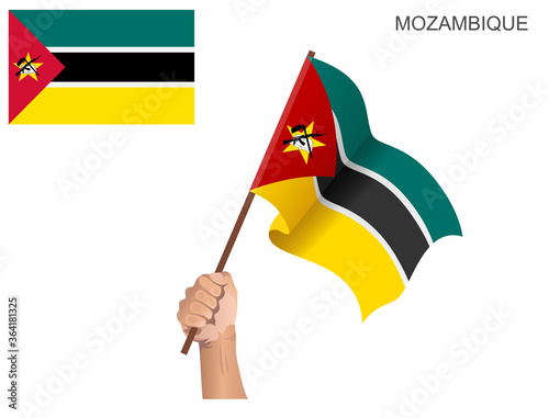 Mozambique's flag is raised with a stick held by hand to ignite the spirit of state