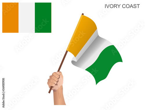 Ivory Coast State Flag hoisted with a stick held in hand to inflame the spirit of statehood