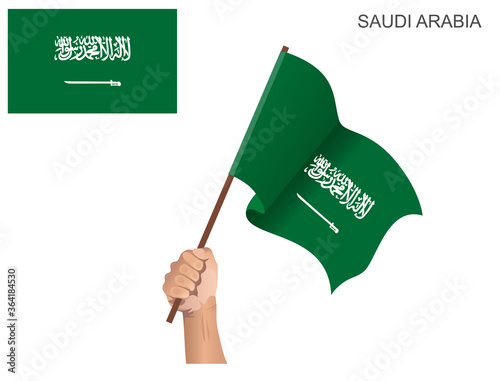 The flag of the State of Saudi Arabia that is hoisted with a stick held by hand to inflame the spirit of statehood