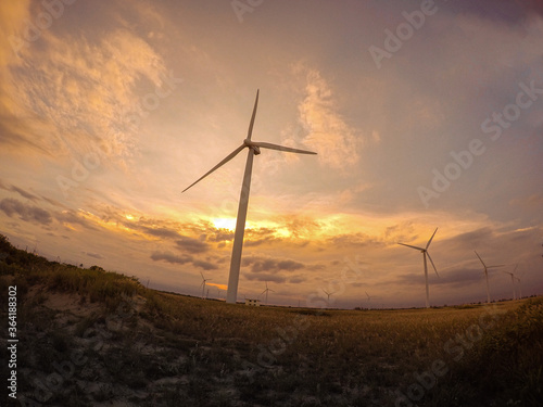Beautiful sunset at the wind power plant in Brazil