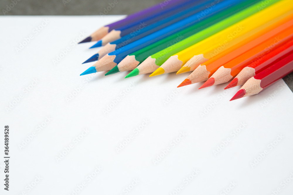 Pattern of Colorful  Many colored pencils on a white paper background and copy space
