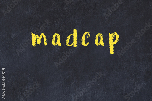 College chalk desk with the word madcap written on in photo