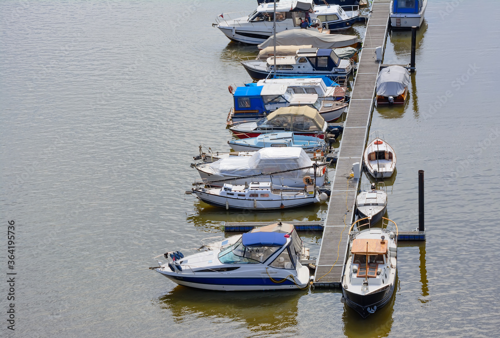 Yachts at the berth on the Vltava River Yachts at the berth on the Vltava River