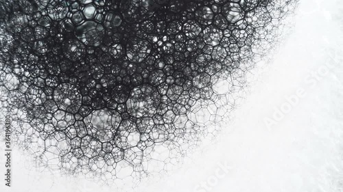 Colorful soap foam with popping bubbles background. Abstract biological structure, macro molecule pattern.
