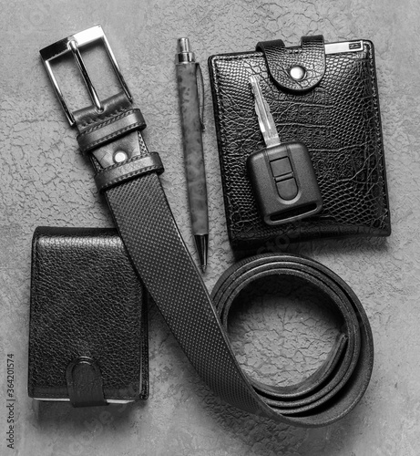 Men's accessories on a black concrete background. The concept of father's day.