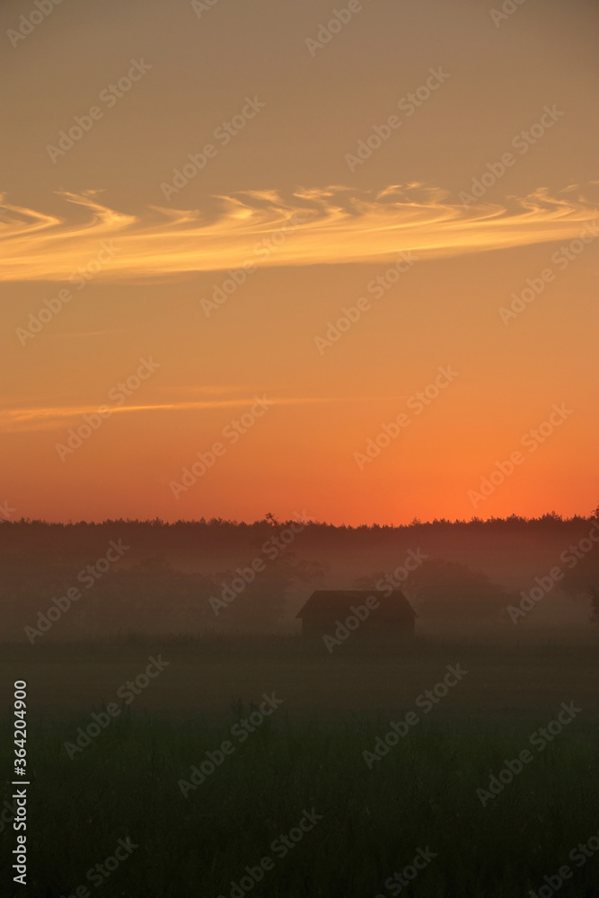 Colorful sunrise by the field, Poland.