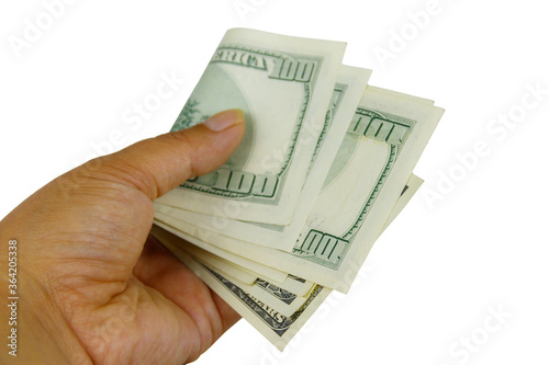 Female hand with one hundred dollars banknotes isolated on white background