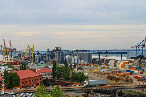 Hoisting cranes  transport containers and granaries at cargo sea port in Odessa  Ukraine