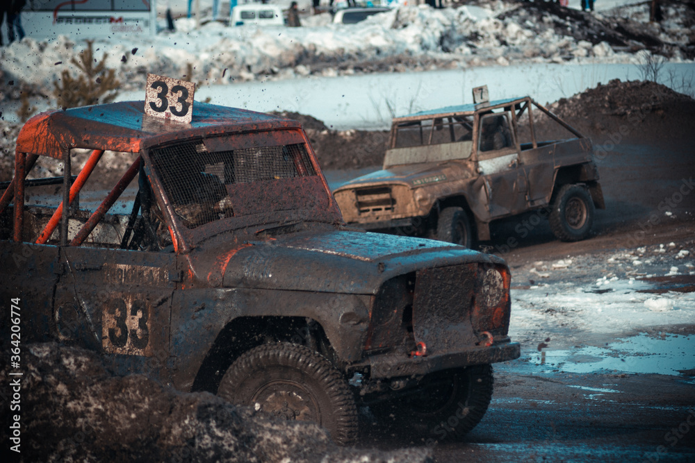 Dirty race cars ride off-road at competitions
