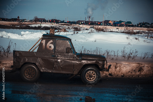 Dirty race cars ride off-road at competitions