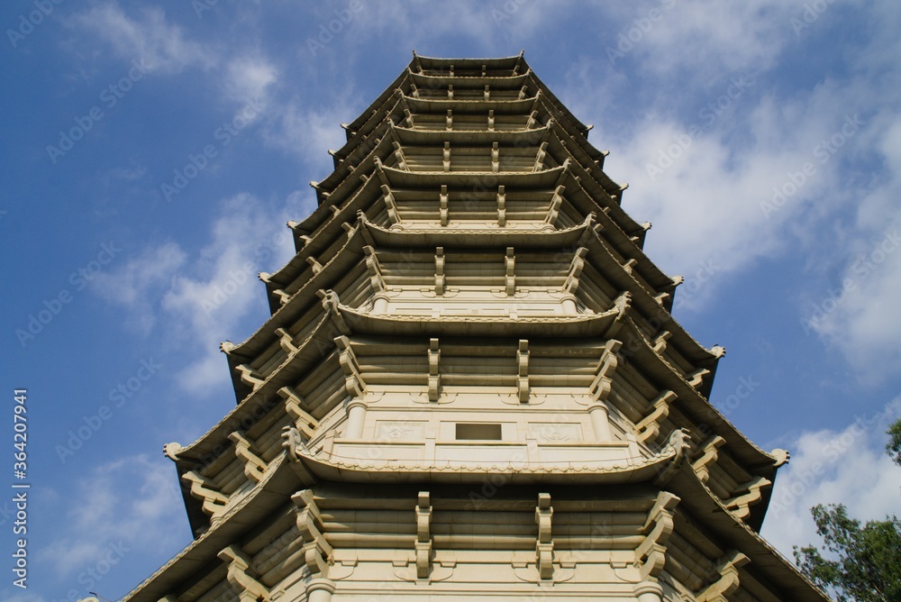 A magnificient view of a Chinese pagoda tower in the evening sunset A magnificient view of a Chinese pagoda tower in the evening sunset