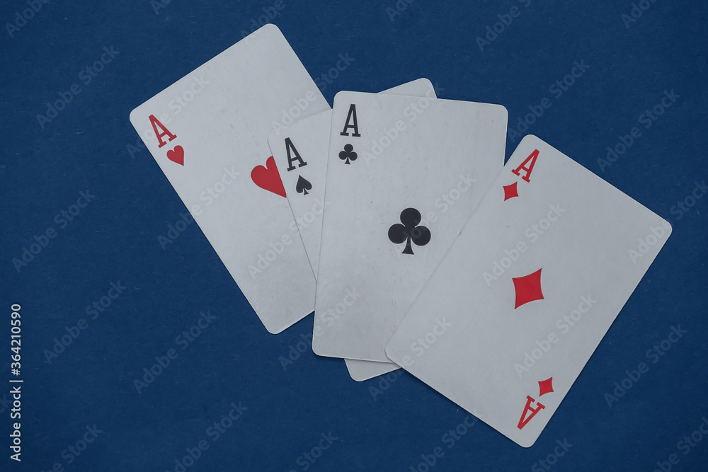 Fototapeta premium Four aces on classic blue background.
