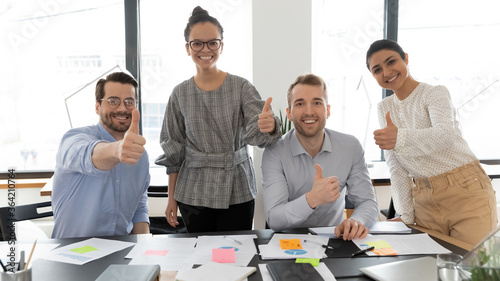 Photography Portrait of smiling multiracial employees posing in office boardroom show thumb