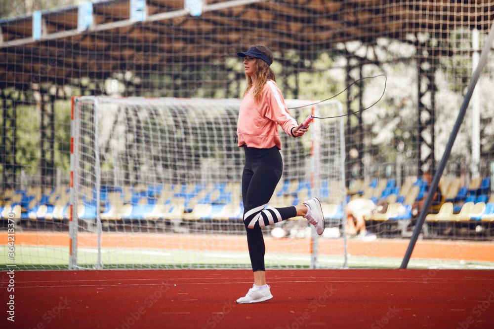 Athletic girls on stadium.