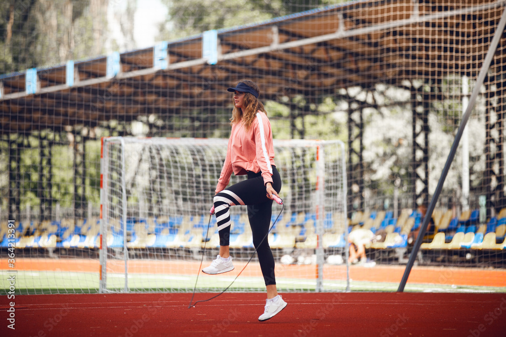Obraz premium Athletic girls on stadium.