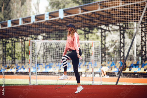 Athletic girls on stadium.