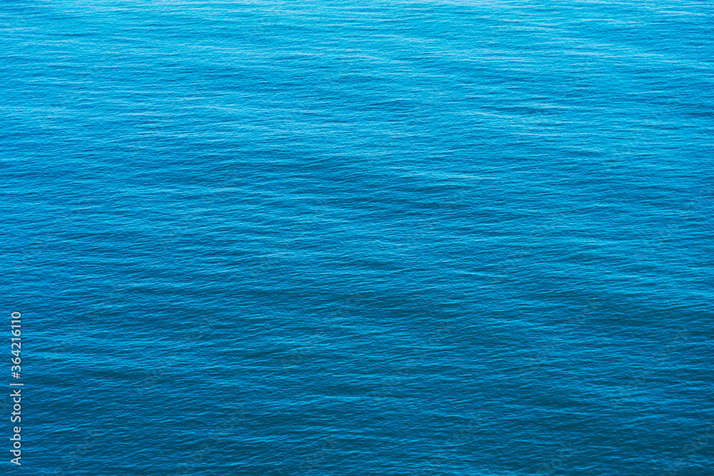 Fototapeta premium Blue sea water surface background, aerial view