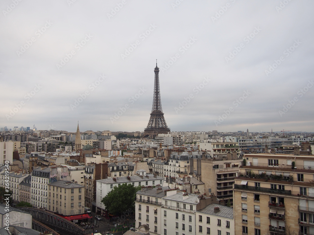 
Paris skyline with the Eiffel Tower on a cloudy cloudy day.