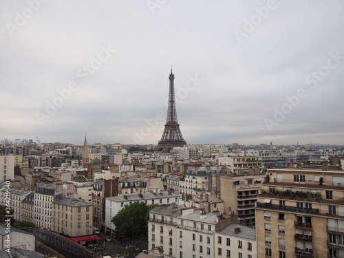  Paris skyline with the Eiffel Tower on a cloudy cloudy day.