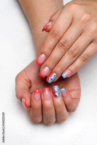 Peach  coral blue french manicure with silver rhombus on long square nails closeup