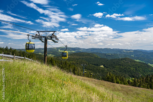 Beautiful view from the Mountain (Belchen) near Freiburg on the beautiful landscape of the Black Forest and the (Belchenbahn) ropeway.