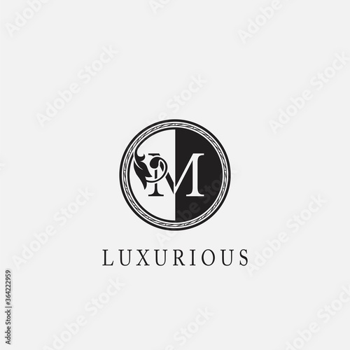 Circle M Letter Logo Icon. Classy Vintage Ornate Leaf Shape design on black and white color for business initial like fashion, jewelry, beauty salon, cosmetics, spa, hotel and restaurant