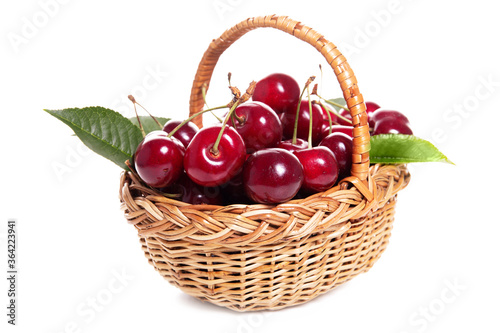 Sweet cherries in a basket isolated on a white background