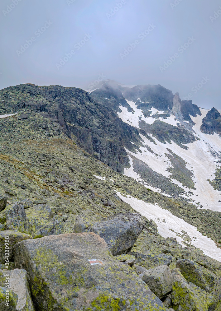 Mountain Landscape with Snow-Capped Peaks in the Clouds 6